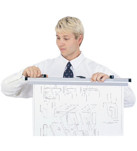 Safco 50056 42 x 60-inch hanging clamp shown held by a person with a large drawing attached