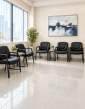 Harwick 820L black leather guest chairs surrounding a coffee table in a bright waiting room